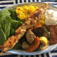 Street Rice Bowl · Yellow street rice, tomatoes, cucumbers, gyro (yeero), chicken or pork souvlaki, roasted fre...