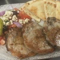 Char-Grilled Pork Chops · Seasoned and char-grilled to perfection served with a side greek salad and your choice of ye...
