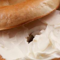 Bagel With Cream Cheese · Toasted bagel with cream cheese on the side.