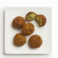 Falafel Pita · Our house-made falafel are made of ground chickpeas, jalapeño, onion, cilantro and seasoning...