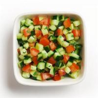 Chopped Salad · A side of chopped salad hand-made with fresh diced cucumber, tomato & cilantro.