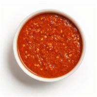 Harissa · Hot red sauce made with chili peppers & seasonings.
