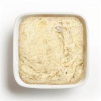 Large Baba Ghanoush · A rich and smoky spread made from roasted eggplant, tahini, and garlic. Comes with fresh bak...