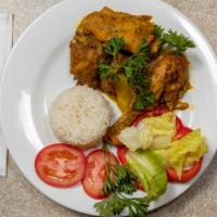 Curry Chicken · Served with your choice of Rice and Peas or White Rice, steamed Cabbage (Can be replaced wit...