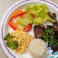 Jerk Chicken · Served with your choice of Rice and Peas or White Rice, steamed Cabbage (Can be replaced wit...