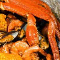 The Perfect Storm · Serve with a cluster of snow crab leg, 1 lb of head-off shrimp, 1/2 lb of black mussels. Int...