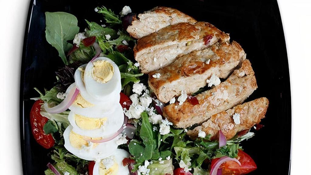 Pesto Turkey Cobb Salad · Ground & pesto seasoned turkey burger, romaine & spinach blend, chopped bacon, blue cheese, avocado, egg, red onion & diced tomatoes with your choice of jalapeno ranch or balsamic vinaigrette.