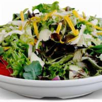 Side Salad · Fresh greens, diced tomatoes, cucumbers, mixed cheese, red onions & your choice of housemade...