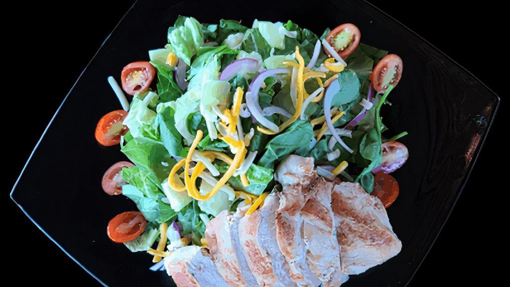 House Salad W/ Chicken · Romaine & spinach blend, diced tomatoes, cucumbers, mixed cheese, red onions & a grilled chicken breast with your choice of one of our housemade dressings.