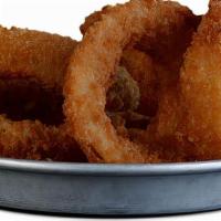Onion Rings · Hand battered in beer batter, deep fried & served with our house made chipotle ketchup.