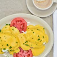 Eggs Benedicts, Poached Eggs On English Muffin With Ham, With Hollandise Sauce · 