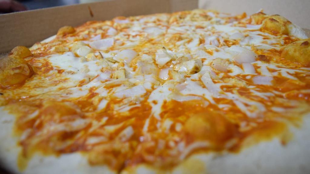 Buffalo Chicken Pizza · Mozzarella cheese topped with grilled chicken and onions.