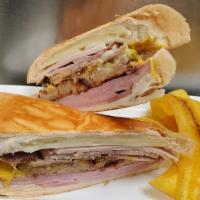 Sandwich De Croqueta Preparada (Croquette Sandwich) · Sandwich using cuban bread along with three exquisite ham croquettes, slices of ham, swiss c...