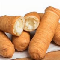Tequeños - Cheese Sticks · Tequeños are sticks of white cheese wrapped with a crunchy and slightly sweet dough, and the...