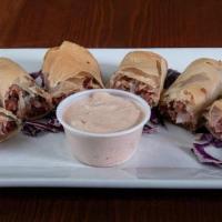 Reuben Spring Rolls · Home-cooked shredded corned beef, swiss cheese, and sauerkraut all hand-rolled and deep frie...