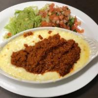 Queso Flameado · Melted monterrey jack cheese topped with chorizo. Comes with a side of tortillas, Pico de ga...