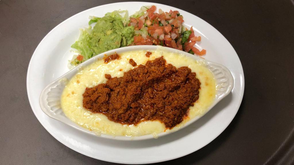 Queso Flameado · Melted monterrey jack cheese topped with chorizo. Comes with a side of tortillas, Pico de gallo and guacamole.
