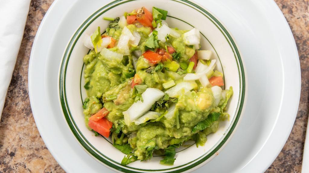 Guacamole · Fresh ripe avocados blended with tomatoes, onions, spices, fresh lime juice and cilantro.