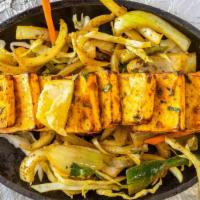 Paneer Tikka · Cubes of cottage cheese marinated in yogurt with bell pepper, onion and cooked in clay oven.