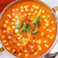 Butter Chicken · Tender, boneless succulent pieces of chicken cooked in a rich tomato based, fresh herb flavo...