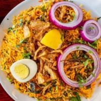 Chicken Biryani · Long grained basmati rice, cooked with succulent pieces of chicken and blended with exotic
I...