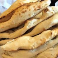 Butter Naan · White flour dough with milk and butter baked in clay oven.
