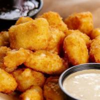 Cheese Curds · Lightly breaded and fried served with side of house made buttermilk ranch. 1120 cal.