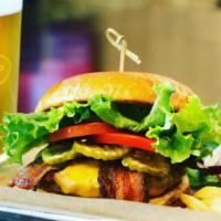 Avocado Burger - Single · House-made guacamole, aged cheddar cheese, Applewood smoked bacon, coleslaw, pickled red oni...