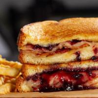 Blackberry Farm · Blackberry jam, creamy Brie cheese, Swiss cheese & Applewood bacon on toasted brioche bread ...