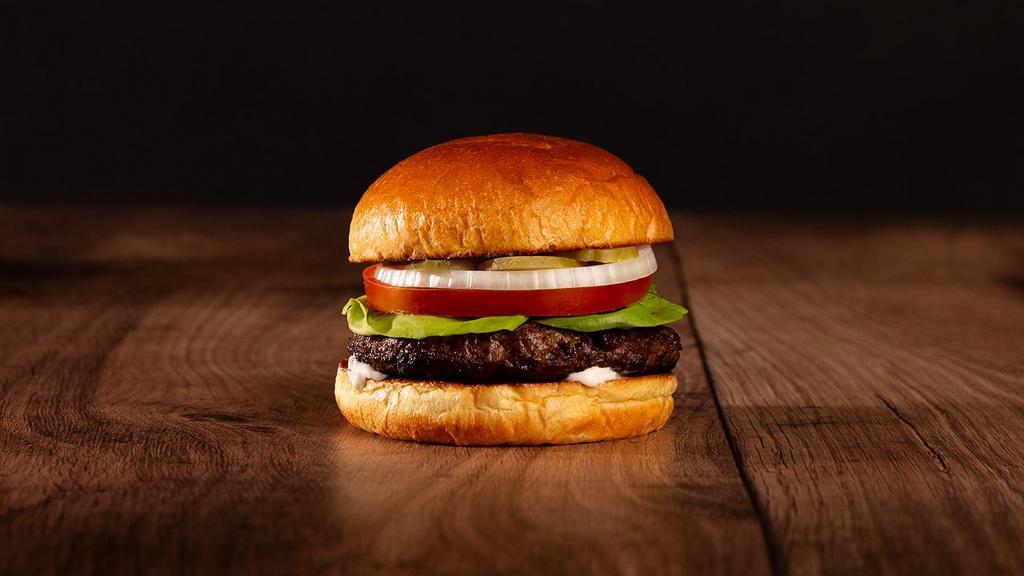 The Burger · Beef patty, lettuce, tomato, onion, pickles, and mayo on a brioche bun.