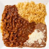 Chile Colorado · Steak tips cooked in red sauce, served with rice, and your choice of refried beans or black ...
