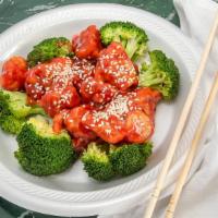 Sesame Chicken · Chunks of fried chicken in sweet and sour sauce with roasted white sesame and broccoli.