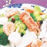 Seafood Delight · Scallops, shrimp with many kinds of vegetable in white sauce.