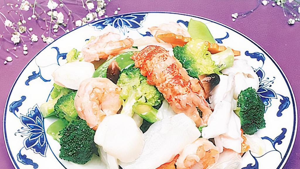 Seafood Delight · Scallops, shrimp with many kinds of vegetable in white sauce.