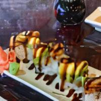 Pearl Harbor Roll · Eel and avocado on top of shrimp tempura, cream cheese and smoke salmon top with eel sauce.