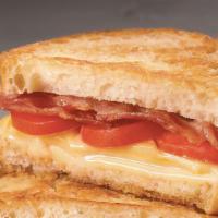 Grilled Cheese, Bacon & Tomato · Bacon, American cheese & tomato on wheat bread.