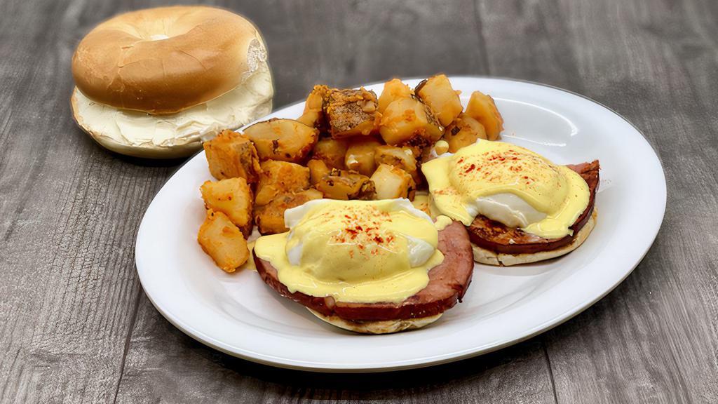 Eggs Benedict · English Muffin topped with Grilled Ham, Poached Eggs, and Homemade Hollandaise Sauce.