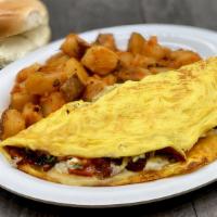 Kitchen Sink Omelette · Everything goes into this Omelette, except the Kitchen Sink!