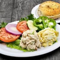 Deli Salad Appetizer | 2 Choices · Lettuce, Tomatoes, Cucumber, Onion, your choice of Bagel, and  (2) large scoop of:  • All Wh...