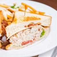 Lou'S Smoked Turkey Club · Topped with swiss, two slices of applewood-smoked bacon, lettuce, tomato, and mayonnaise. Se...