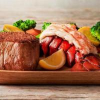 Filet Mignon & Lobster  · A tender and juicy thick cut 6 oz. filet paired with a steamed lobster tail. Served with two...