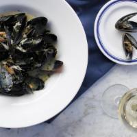 E.I Mussels Gilbert · Shallots, white wine, and cream.