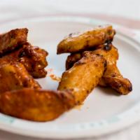 Hot’N Spicy Buffalo Chicken Wings · A full pound of oven-roasted chicken wings tossed in fiery buffalo sauce.