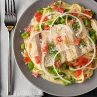 Chicken Alfredo · White chicken meat and spaghetti in Alfredo sauce with tomatoes, onions, green peppers and b...