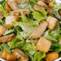 Chicken Caesar Salad · Romaine lettuce, Parmesan cheese, croutons and grilled chicken strips.