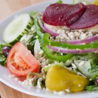 Greek Salad · Our mouthwatering Greek salad made with lettuce, beets, cucumber, tomato, kalamata olives, p...