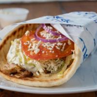 Greek Chicken Pita - Salad & Drink Combo · Feta cheese, lettuce, tomatoes, onions, and tzatziki. Comes with Greek salad & drink.