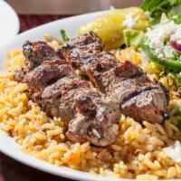Lamb Skewers (Souvlaki) Light Meal · Two char grilled Lamb skewers over rice with a Greek salad. Served with pita bread.