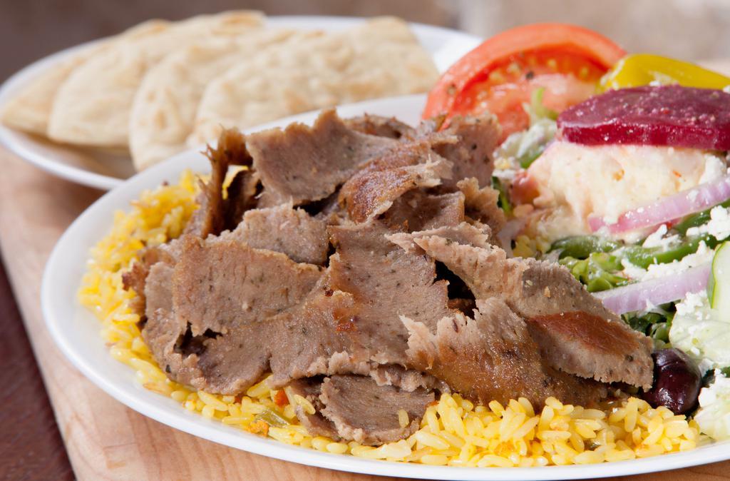 Gyro Platter · Little Greek Favorite. Gyro meat over rice with a Greek salad.