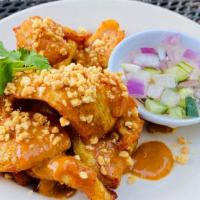 Chicken Satay · Contains peanuts. Marinated grilled chicken w/ peanut sauce and peanut crush on top have a s...
